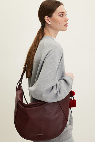 Soft Faux Leather Oval Crossbody Bag Burgundy